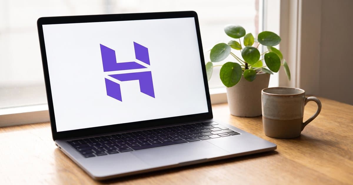The Hostinger logo on a laptop screen