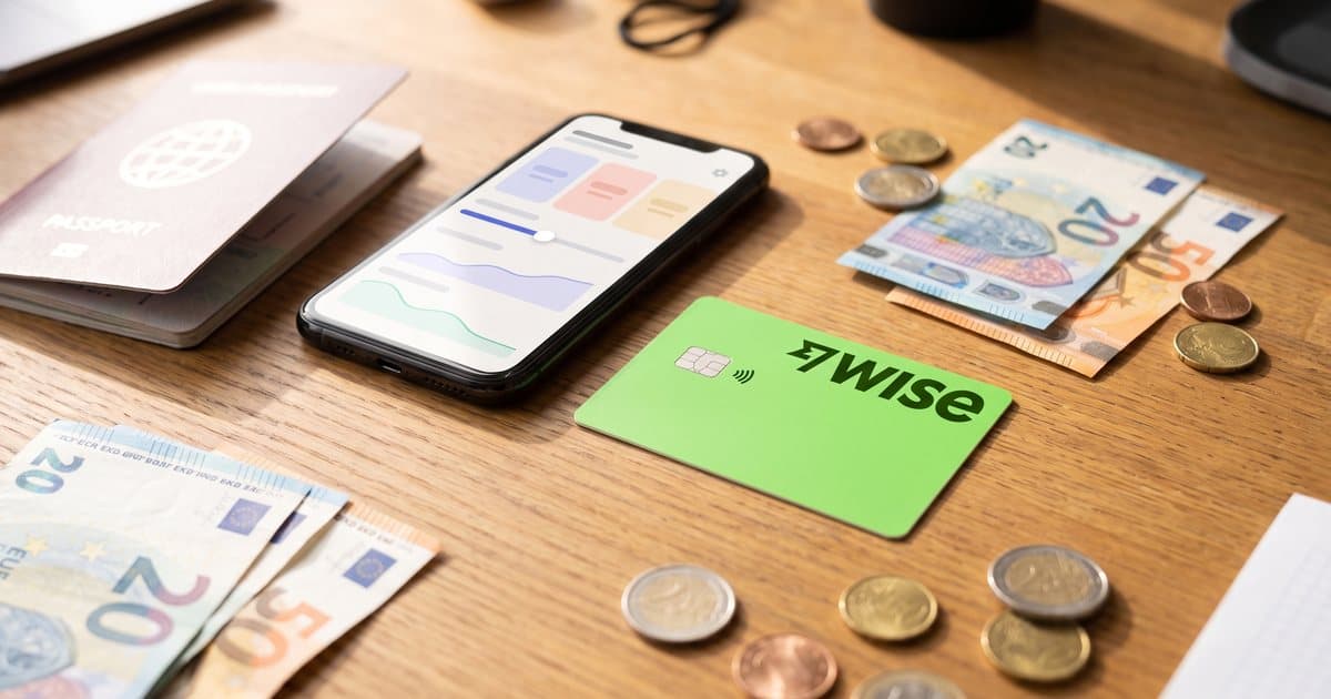 A Wise debit card with a passport and euros