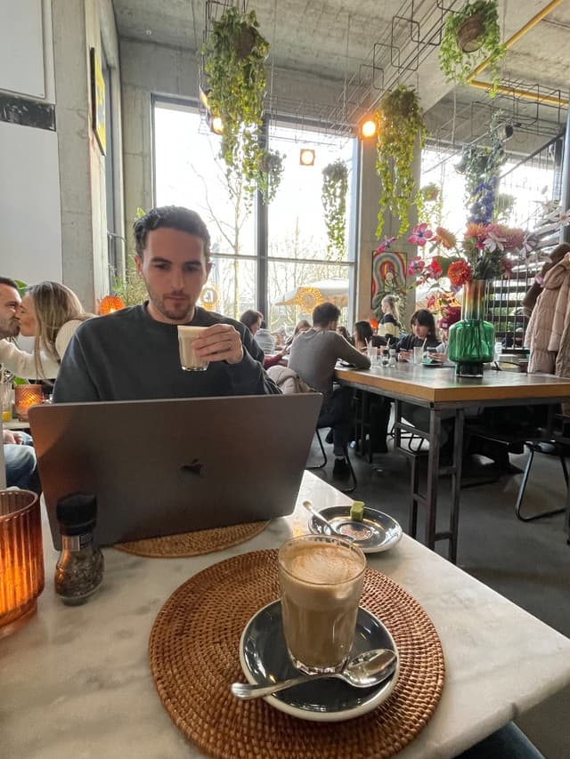 Mike McDonnell working from a cafe