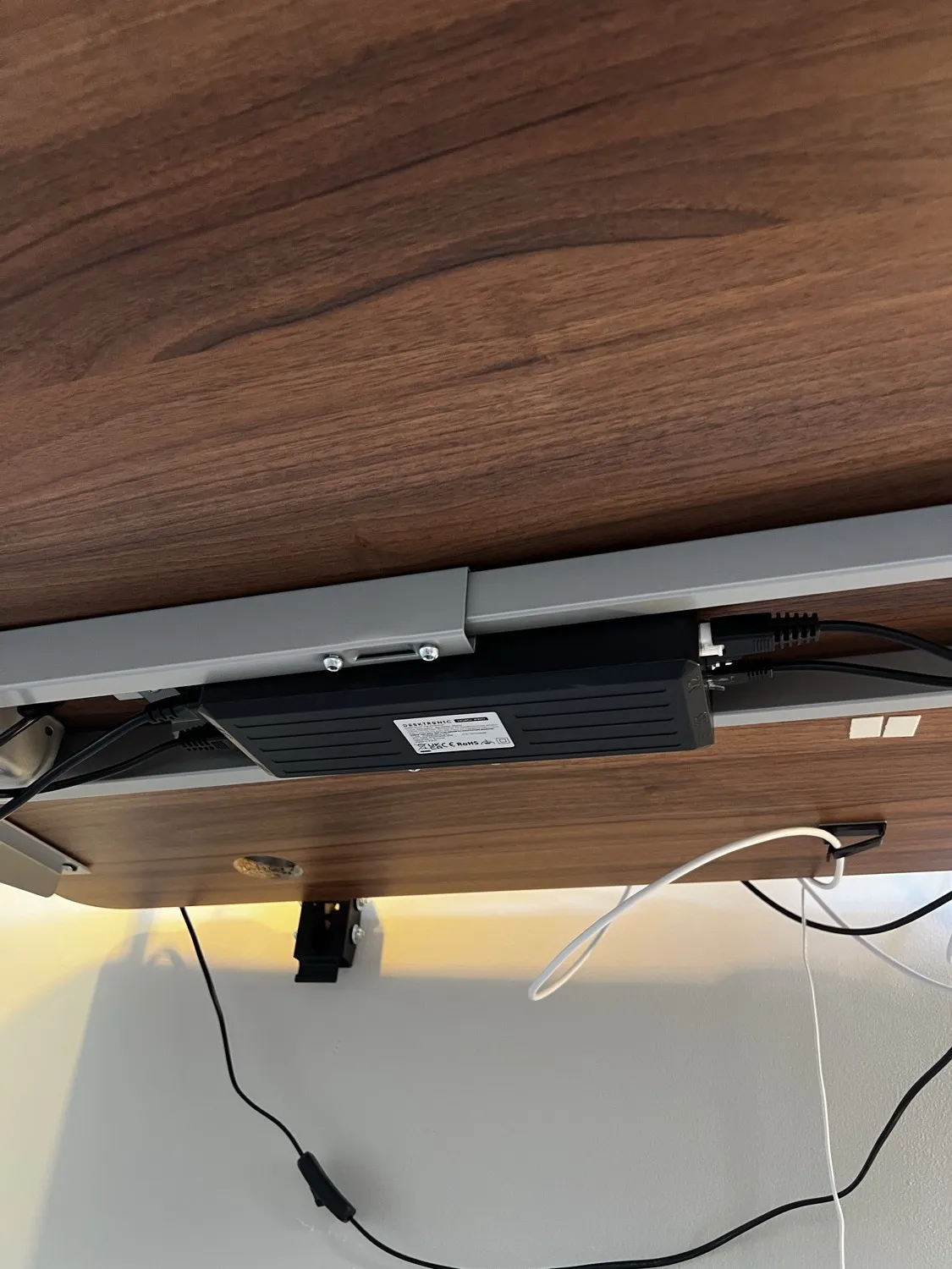 The dual-motor control box mounted under the Desktronic HomePro desktop