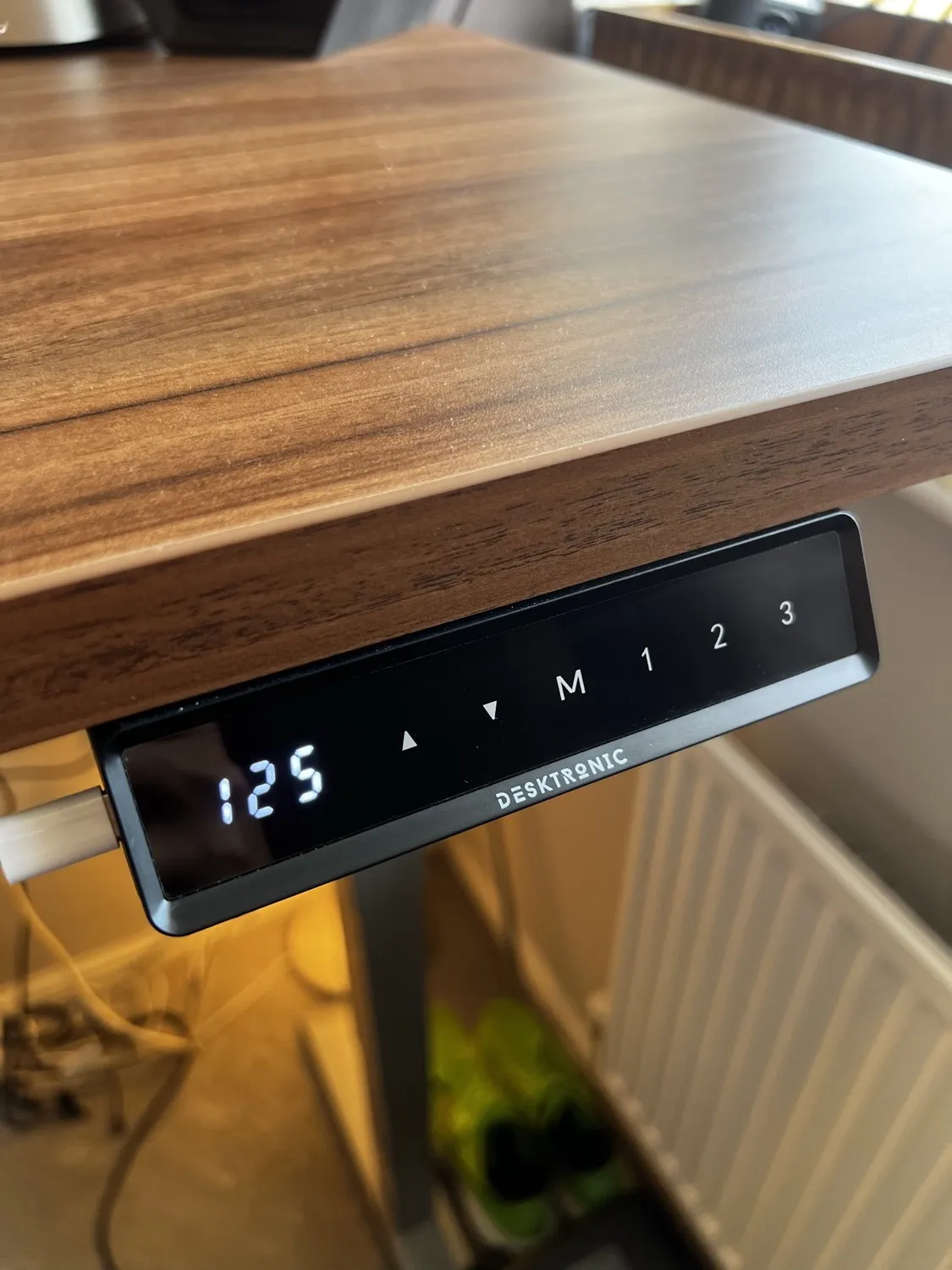 Desktronic HomePro touchscreen controller showing the height readout and three memory presets