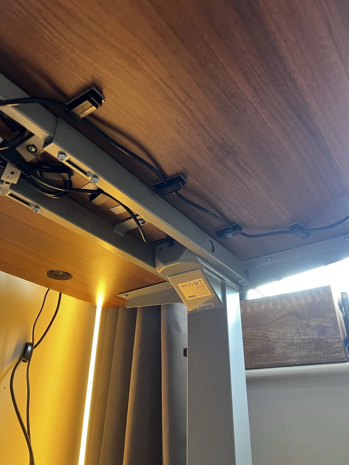 Underside of the Desktronic HomePro showing the steel frame and cable management clips